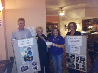 Lion President Vicky presenting the cheque to FADSAD accompanied by Ian & Jenny, owners of The Crofton 